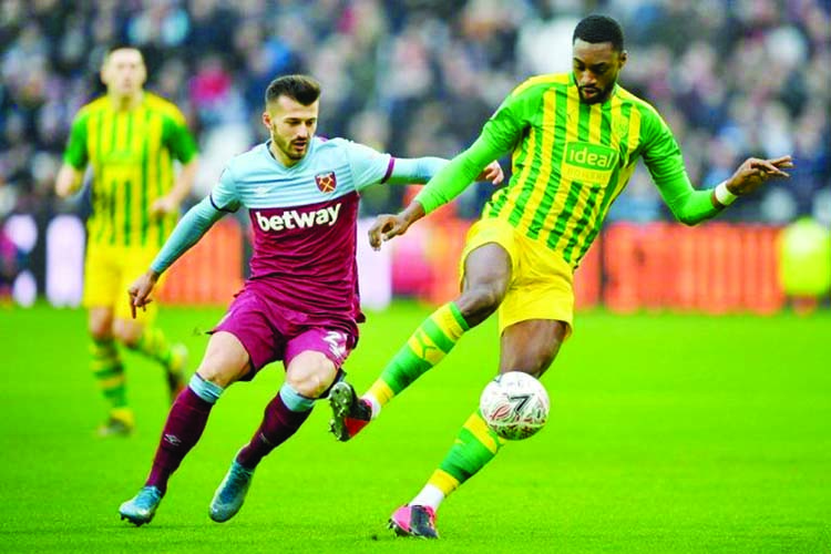 West Ham United's Swiss striker Albian Ajeti (left) vies with West Bromwich Albion's Nigerian defender Semi Ajayi (right) during the English FA Cup fourth round football match between West Ham United and West Bromwich Albion at The London Stadium, in Ea