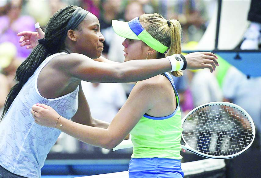 Sofia Kenin (right) of the U.S. is embraced by compatriot Coco Gauff after winning the fourth round singles match at the Australian Open tennis championship in Melbourne of Australia on Sunday.