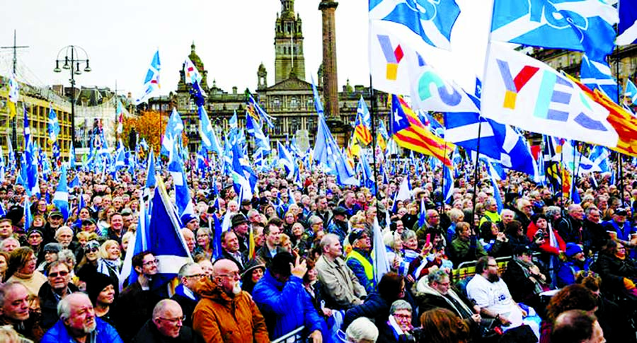 Thousands of people filled Glasgow's George Square waving a variety of flags.