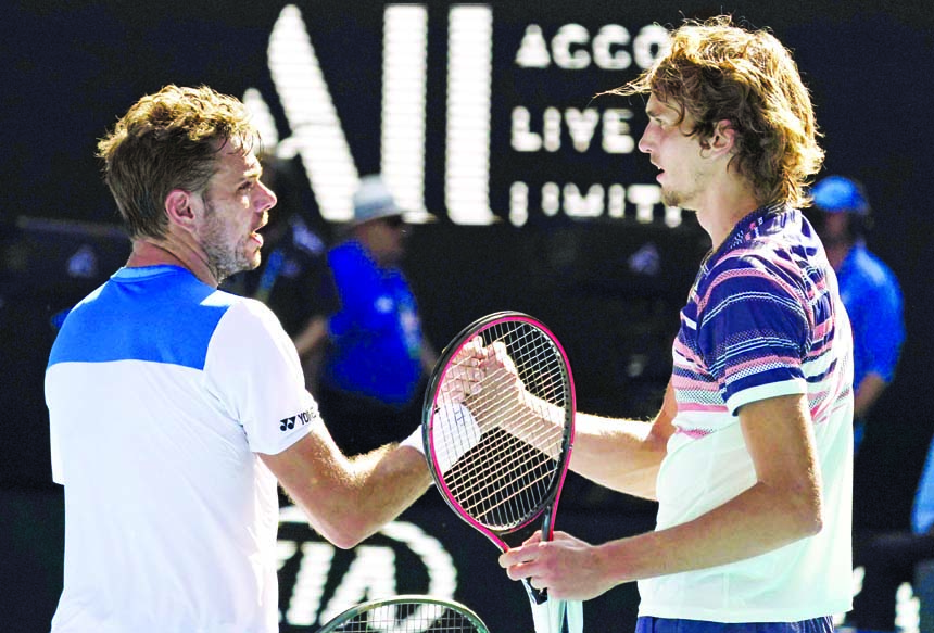 Germany's Alexander Zverev (right) is congratulated by Switzerland's Stan Wawrinka after winning their quarter-final match at the Australian Open tennis championship in Melbourne of Australia on Wednesday.