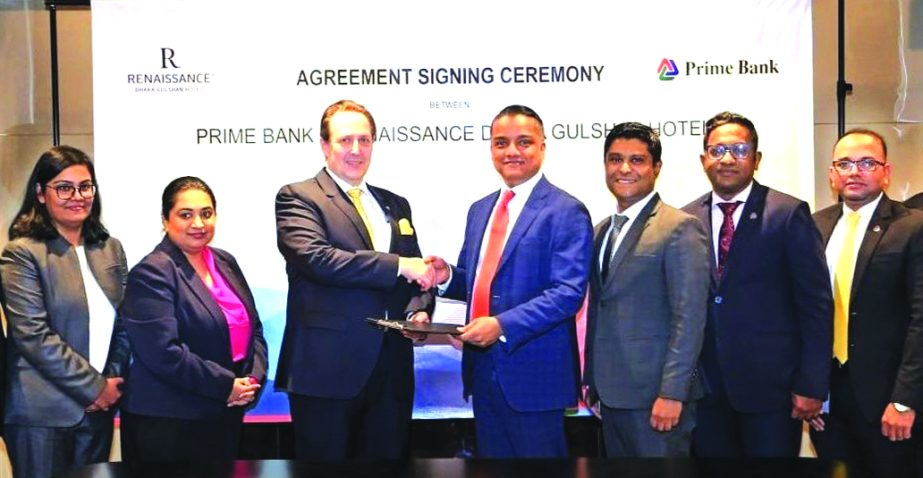 ANM Mahfuz, Head of Consumer Banking of Prime Bank Limited and Jerome Lienart, General Manager of Renaissance Dhaka Gulshan Hotel, exchanging documents after signing the Buy-One-Get-One (BOGO) deal at the hotel in the city recently. Under the deal, Platin