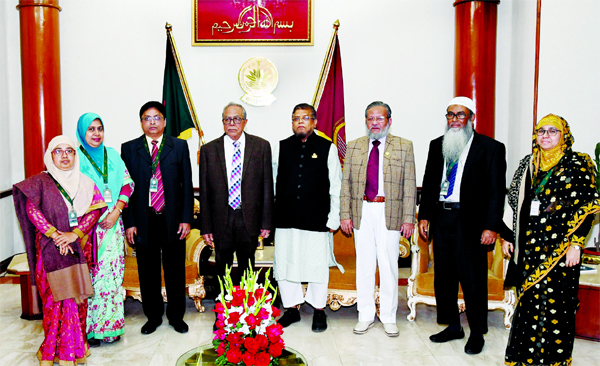 President Md. Abdul Hamid poses for a photo session with the delegation of Bangladesh Textiles University when the delegation led by its Vice-Chancellor Prof Abul Kashem called on the President at Bangabhaban on Thursday.