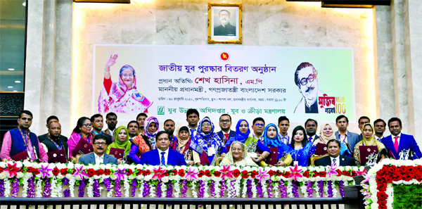 Prime Minister Sheikh Hasina at a photo session with the recipients at Jatiya Jubo Purasker-2019 organised by Department of Youth Development and the Ministry of Youth and Sports held at PMO on Thursday.