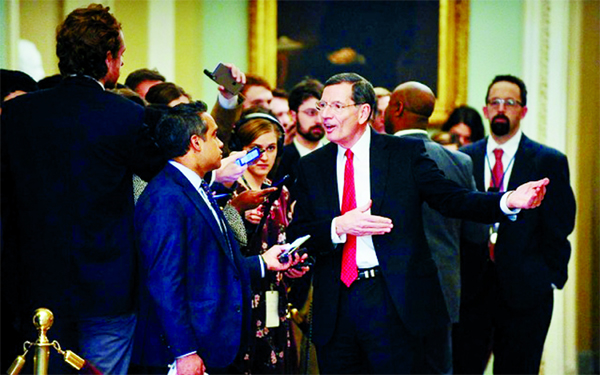 Sen John Barrasso (R-WY) talks to media near the Senate floor during a brief recess from the day's Senate impeachment trial of President Donald Trump in Washington, US.