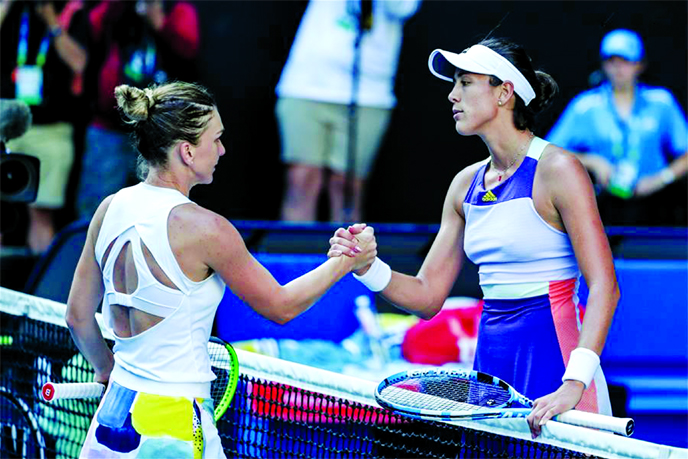 Garbine Muguruza (right) of Spain shakes hands with Simona Halep of Romania after their women's singles semifinal match at the Australian Open tennis tournament in Melbourne of Australia on Thursday.
