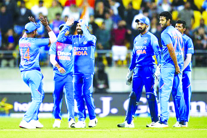 Players of Indian team celebrate a wicket during the fourth T20 international against New Zealand, in Wellington of New Zealand on Friday.