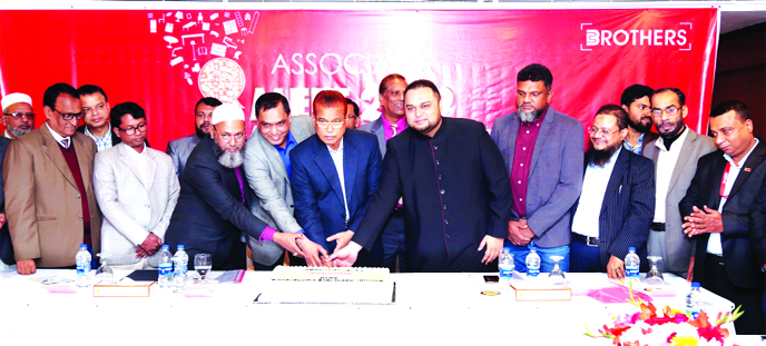 Habibur Rahman Sarkar, Chairman of Brothers Furniture Limited, inaugurating the Associate Conference of the company by cutting a cake at a hotel in the city recently. Md. Elias Sarkar, Managing Director, Sharifuzzaman Sarkar, Director and Monirul Islam Bo