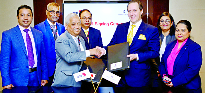 Arif Quadri, AMD of United Commercial Bank Limited and Jerome Lienart, General Manager of RENAISSANCE DHAKA GULSHAN HOTEL, exchanging document after signing an agreement at the bank's head office in the city recently. Under the deal, Platinum Credit Card