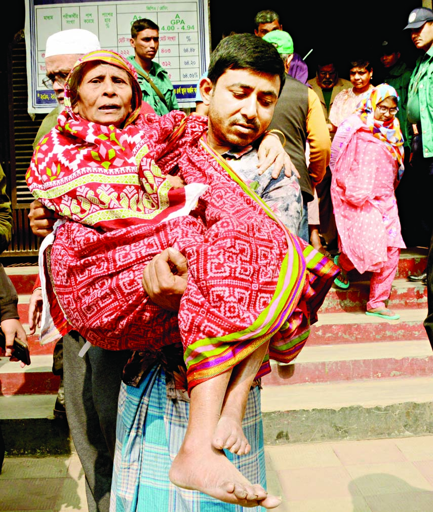 An octogenarian woman with the help of her relative coming to polling center to cast her vote in Dhaka City Corporation election. The snap was taken from Uttara Milestone College on Saturday.