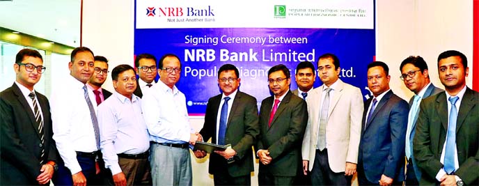 Mamoon Mahmood Shah, AMD of NRB Bank Limited and Md. Afzal Hossain, General Manager of Popular Diagnostic Center Limited, exchanging document after signing an agreement at the bank's head office in the city recently. Under the deal, the diagnostic center