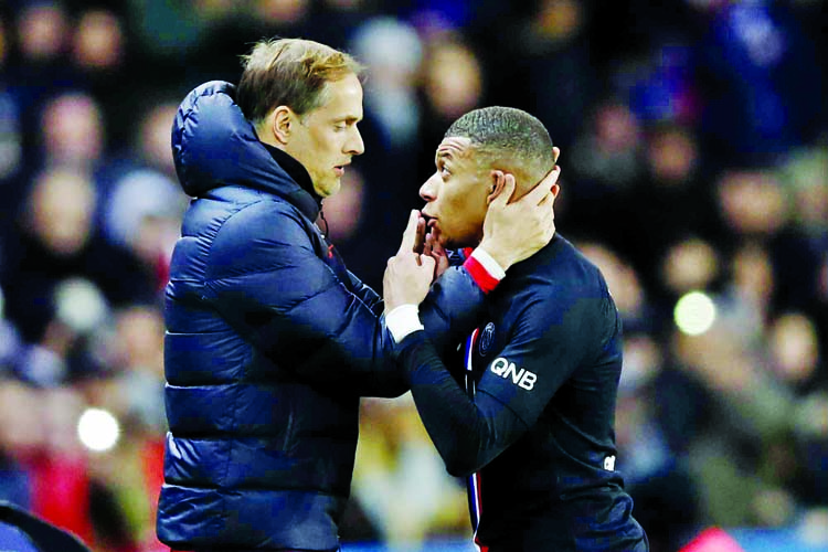 PSG's Kylian Mbappe (right) talks with PSG's head coach Thomas Tuchel during the French League One soccer match between Paris-Saint-Germain and Montpellier at the Parc des Princes stadium in Paris on Saturday.