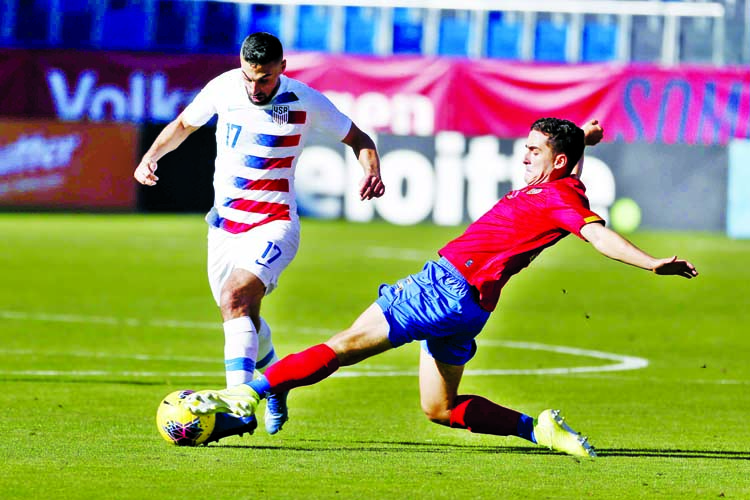 United States midfielder Sebastian Lletget (17) dribbles as Costa Rica midfielder Bernald Alfaro (15) defends during the second half of an international friendly soccer match in Carson, Calif. on Saturday. The U.S. won 1-0.