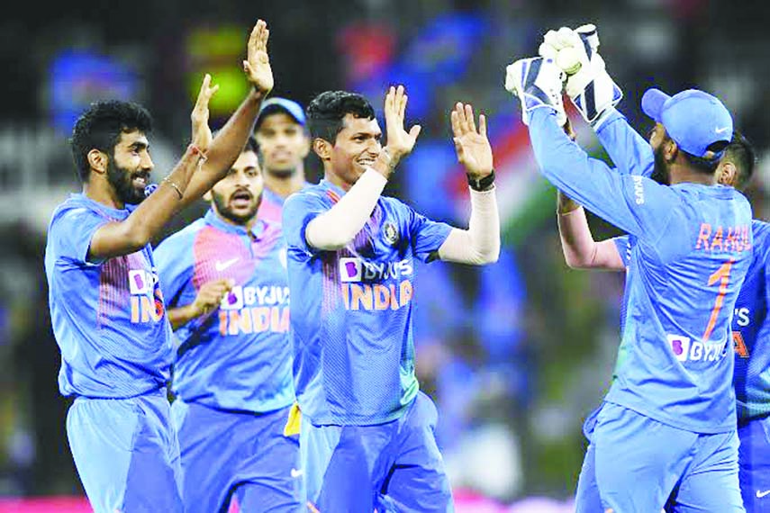 Indian players celebrate the wicket of Ross Taylor during the final Twenty20 against New Zealand at Bay Oval in New Zealand on Sunday.