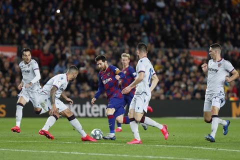 Barcelona's Lionel Messi (3rd from left) tries to get through the Levante defense during a Spanish La Liga soccer match between Barcelona and Levante at the Camp Nou stadium in Barcelona, Spain on Sunday.