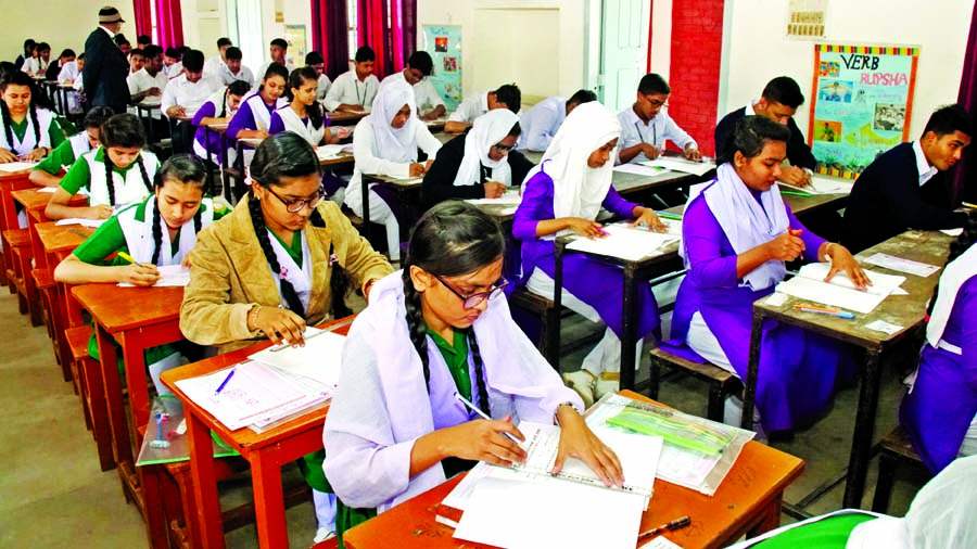 Students sit for the Secondary School Certificate (SSC) and equivalent exam at Tejgaon Government Girlsâ€™ High School center in Dhaka on Monday.