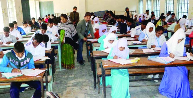 NAOGAON: Students sit for SSC examination at a school centre in Naogaon during the first day of the examination on Monday.