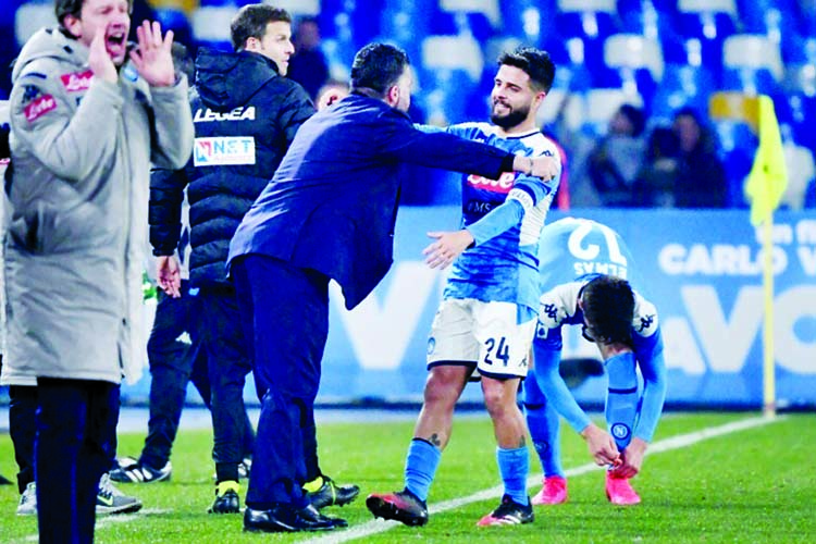 Napoli captain Lorenzo Insigne celebrates with coach Gennaro Gattuso after beating Sampdoria in their Serie A soccer match in Italy on Monday.