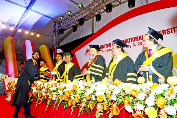 Education Minister Dr Dipu Moni distributing gold medal among the graduates of UIU at its 6th convocation held on its campus at Madani Avenue, Badda in the city on Thursday. Prof Dr Gowher Rizvi, International Affairs Advisor to Prime Minister was present