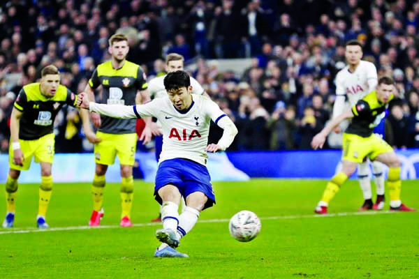 Tottenham's Son Heung-min scores his side's third goal from the penalty spot during the English FA Cup fourth round replay soccer match between Tottenham Hotspur and Southampton at the Tottenham Hotspur Stadium in London on Wednesday.