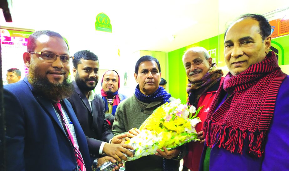 Officials of Rajbari branch of Al- Arafah Islami Bank Bangladesh Limited, congratulating with bouquet to Kazi Keramat Ali, MP, while he visited the branch recently.