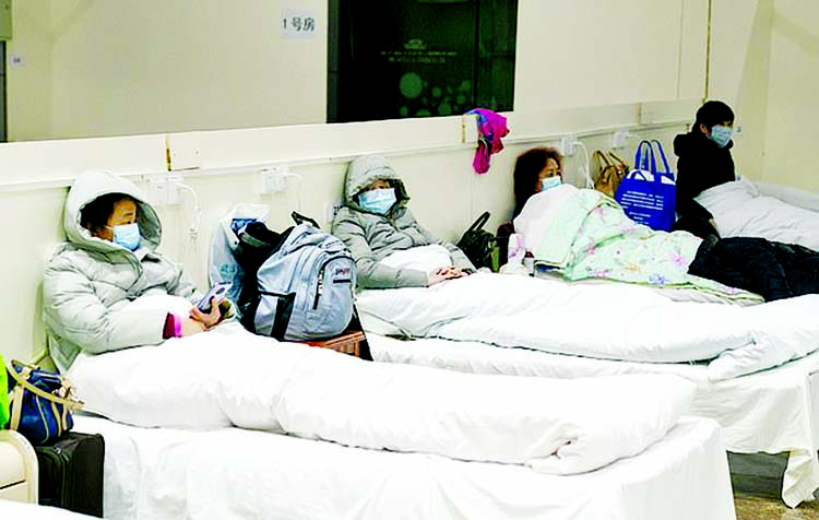 Patients infected with the novel coronavirus are seen at a makeshift hospital converted from an exhibition center. Coronavirus Outbreak, Wuhan. Internet photo