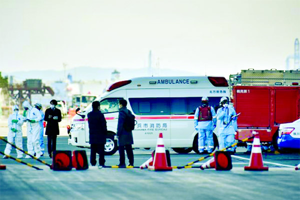 An ambulance departs the Daikoku pier Cruise Terminal in Yokohama on 6 February after bringing patients from the Diamond Princess cruise ship.