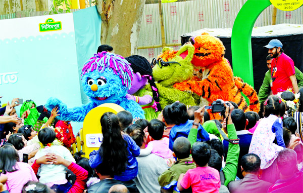 Children thronged the Shishu Prahar 'Sisimpur' at Ekushey Boi Mela on Friday.