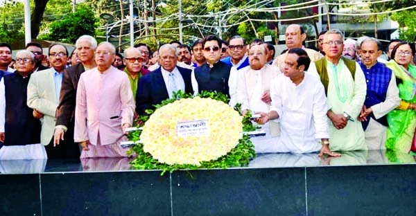 Newly-elected DNCC Mayor Barrister Fazle Noor Taposh along with senior leaders of Bangladesh Awami League placing wreaths at the portrait of Bangabandhu at Dhanmondhi 32 in the city yesterday .
