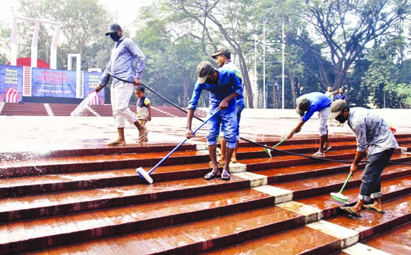 Workers are engaged in cleaning Central Shaheed Minar in the city on Monday ahead of Amar Ekushey and also International Mother Language Day.