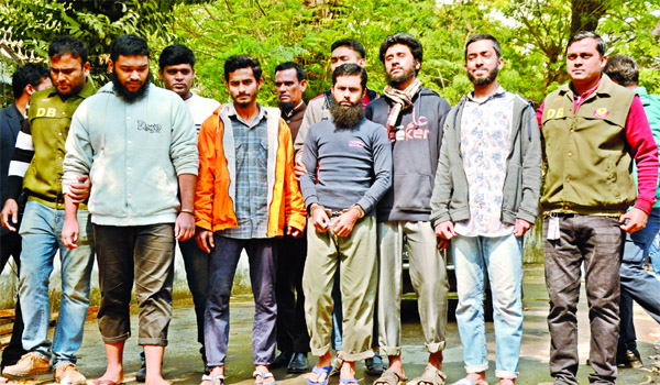 Dhaka Metropolitan Police's (DMP) Counter Terrorism and Transnational Crime (CTTC) unit personnel present five suspected members of the banned militant outfit Ansar-al-Islam alias Ansarullah Bangla Team before media on Monday after their arrest from Dhak
