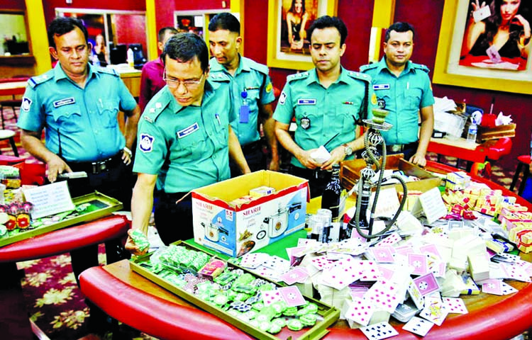 Law enforces seized different gambling equipment from an illegal Casino during raid at a sporting club in Motijheel in Dhaka last year. File Photo