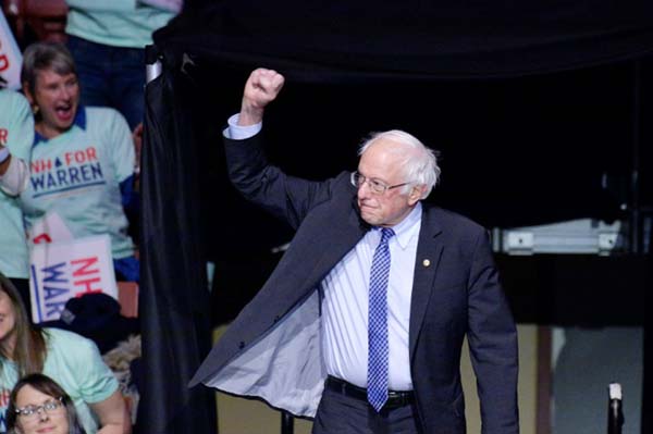 Buoyed by a strong showing in Iowa caucuses, Bernie Sanders has for the first time claimed national frontrunner status in the Democratic nomination race, according to a new poll