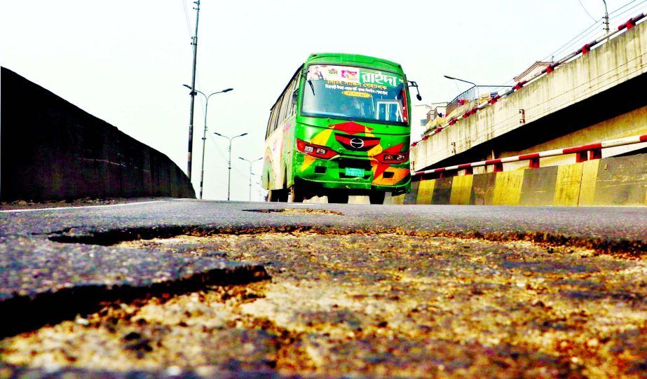 Potholes developed on Malibagh-Maghbazar flyover which may caus fatal accident anytime. This picture was taken on Tuesday.