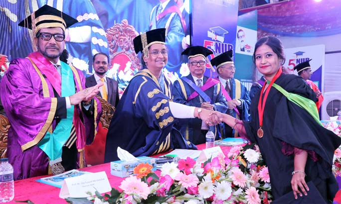 Education Minister Dr Dipu Moni, MP presents medals to the graduates of the Northern University, Bangladesh at its 5th Convocation held at the University campus recently.