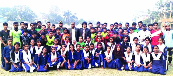 The participants (boys & girls) of the month-long cricket coaching camp with Headmaster of Singair Government High School Md Akram Hossain, Physical Education Teacher and former national athlete Md Altaf Hossain, Director and Head Coach of Language Martyr