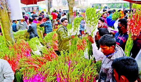 Traders passing busy days to collect flowers for selling on the occasion of Pahela Falgun and Valentine's Day. This photo was taken from cityâ€™s Shahbagh flower market on Thursday.