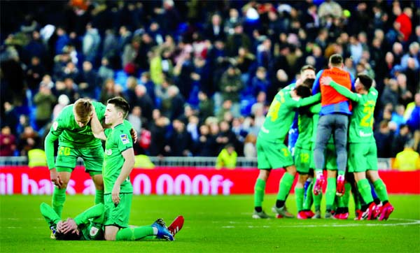 Real Sociedad players celebrate after the match against Real Madrid, at Madrid in Spain on Thursday.