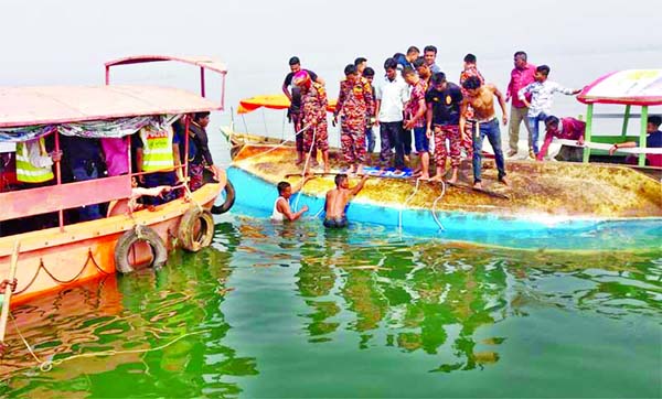 Fire Service personnel conduct search and rescue operation as five people drowned and three children went missing after a water vessel carrying tourists sank in Kaptai Lake near Rangamati on Friday noon.