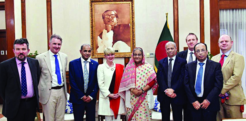 Prime Minister Sheikh Hasina poses for a photo session with the team of representatives of Gastro-Enterology physicians when the team called on her (PM) at Gonobhaban on Saturday. PID photo