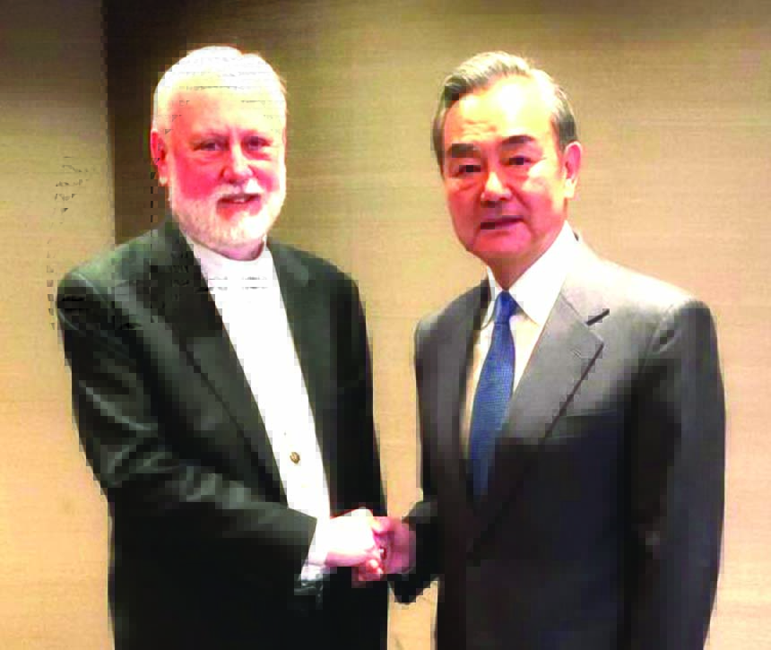Vatican FM Archbishop Paul Gallagher (left) shaking hands with Chinese Foreign Minister Wang Yi on the sidelines of the Munich 2020 security conference in Munich on Friday.