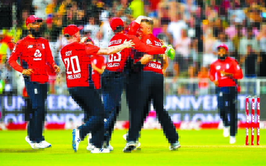 Players of England celebrate after Tom Curran takes Bjorn Fortuin's wicket to win the second T20I match against South Africa, at Durham in South Africa on Friday.