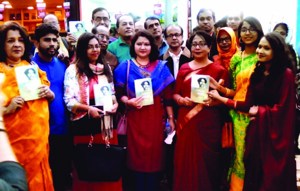 General Secretary of Nazrul Academy Mintu Rahman along with others holds the copies of a book titled 'Bidrohi Kabitar Nandantatwa' written by Poet Hasan Alim at its cover unwrapping ceremony held recently at the Ekushey Book Fair in the city.