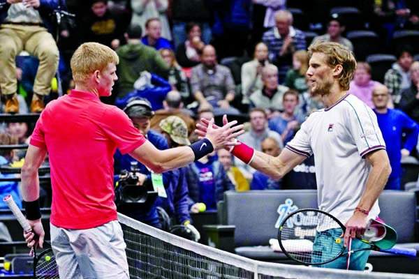 Kyle Edmund (left) of Britain, shakes hands with Andreas Seppi, of Italy, after Edmund's 7-5, 6-1 win in the final of the New York Open tennis tournament on Sunday.