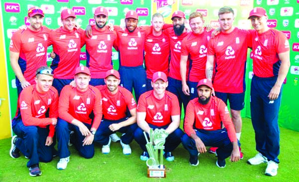 England cricketers pose with the trophy after winning the T20 series against South Africa at Super Sport Park on Sunday.