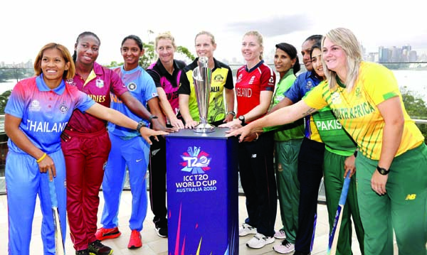 The captains of the 10 countries participating in the Women's T20 World Cup pose for a photo with the trophy in Sydney on Monday. The tournament begins Friday, Feb. 21. (From left to right) are, Sornnarin Tippoch of Thailand, Stafanie Taylor of West Ind