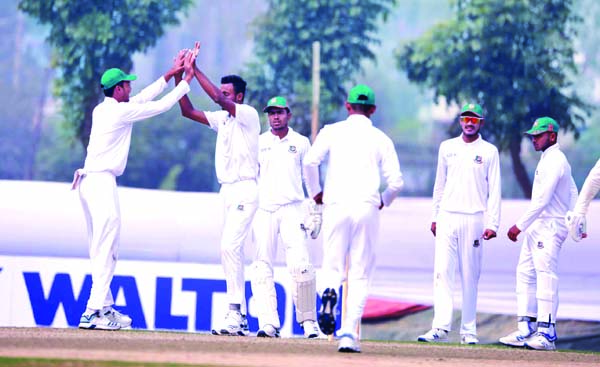 Players of BCB XI, celebrating after dismissal of a wicket of Zimbabwe Cricket team during the first day play of the two-day practice match at BKSP Ground in Savar on Tuesday.