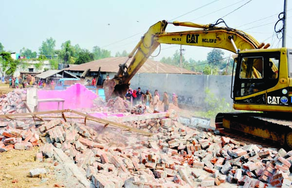 BOGURA: Roads and Highways Department evicting illegal establishment beside second by-pass road in Bogura yesterday.