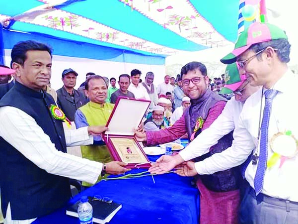 NANDAIL ( Mymensingh) Md Anwarul Abedin Khan Tuhin MP receiving crest at a prize giving ceremony of annual sports competition of Uluhati Shimultola Pre-Cadet School in Nandail upazila recently.