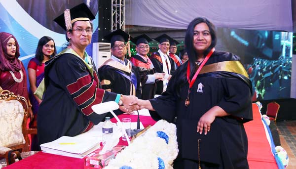 Education Minister Dr Dipu Moni, MP represents the President and Chancellor of the East West University conferring degrees among the students at its 19th Convocation held at the University campus on Monday.
