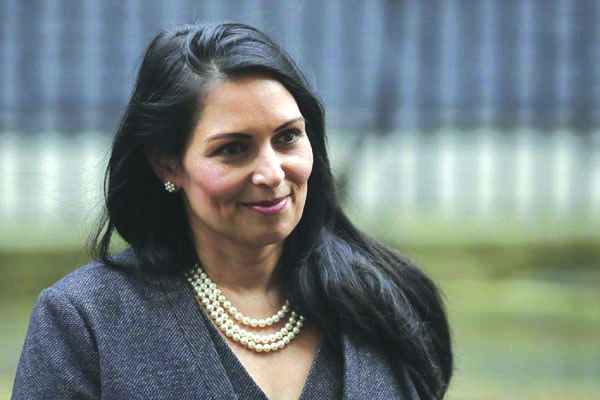 British Lawmaker Priti Patel, the Home Secretary leaves 10 Downing Street in London, on Thursday. British Prime Minister Boris Johnson shook up his government on Thursday, firing and appointing ministers to key Cabinet posts. Johnson was aiming to tighten